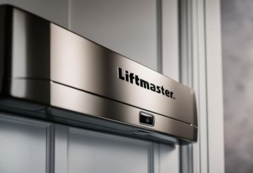 Close-up of a modern LiftMaster garage door opener mounted on a white paneled garage ceiling in Magna, Utah.